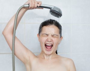 person-looking-distressed-in-the-shower